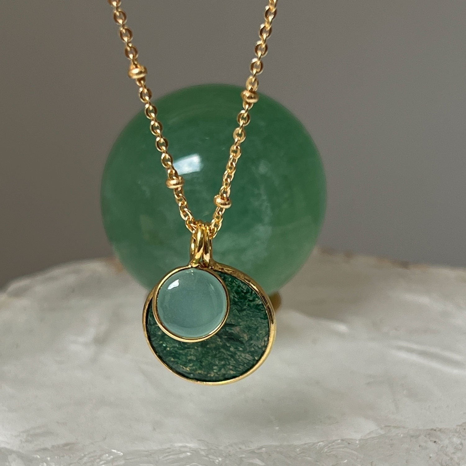 Mirabelle Jewellery Duo Jade & Aqua Chalcedony Pendant on a gold satellite chain. Features a green jade disc and a pale blue chalcedony cabochon.