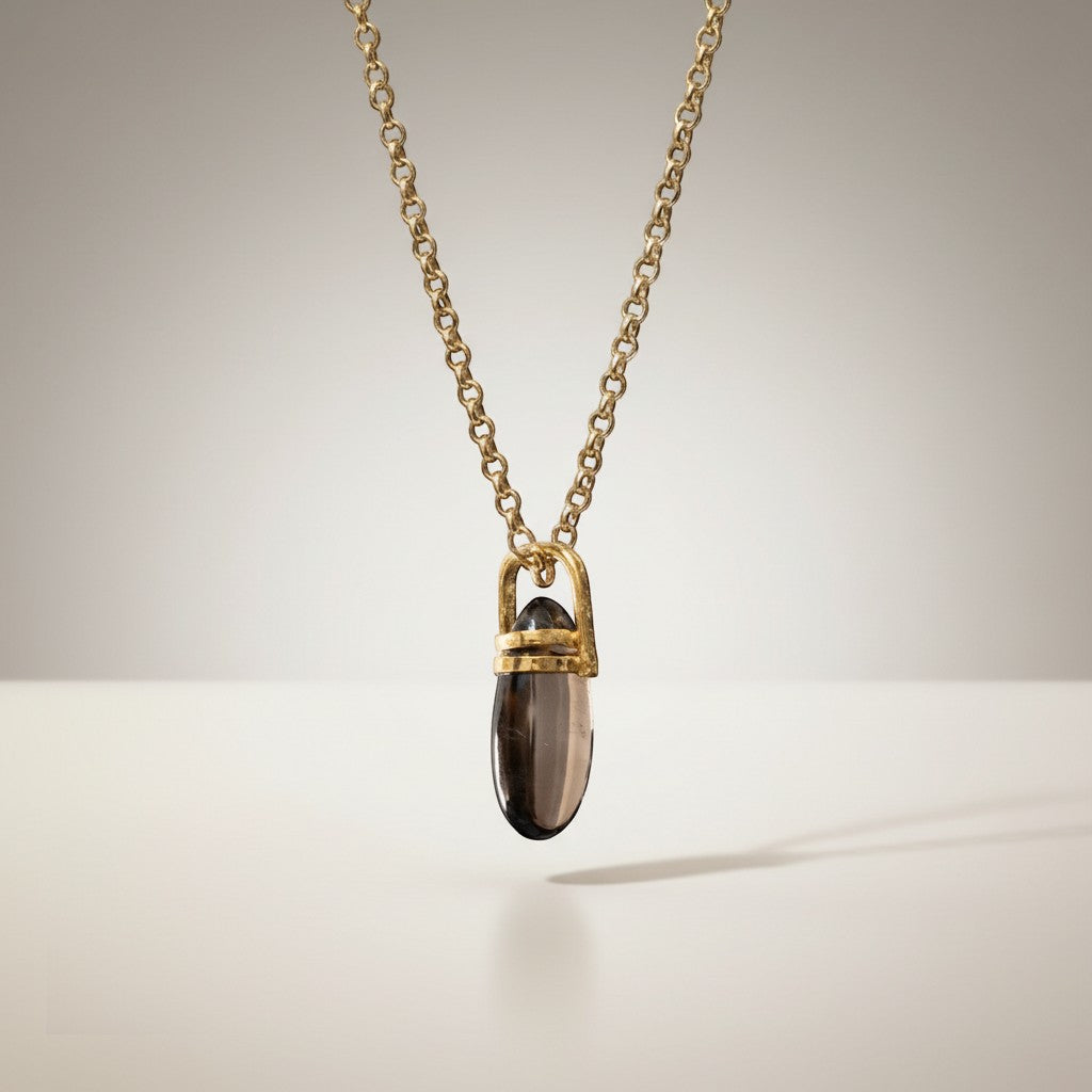 Mirabelle Jewellery smoky quartz pebble pendant in 22ct gold plated brass on a delicate gold belcher chain
