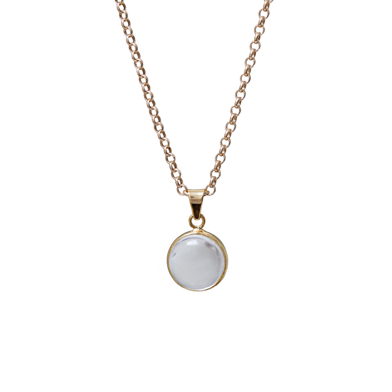 Necklace with a round rock crystal pendant on a white background