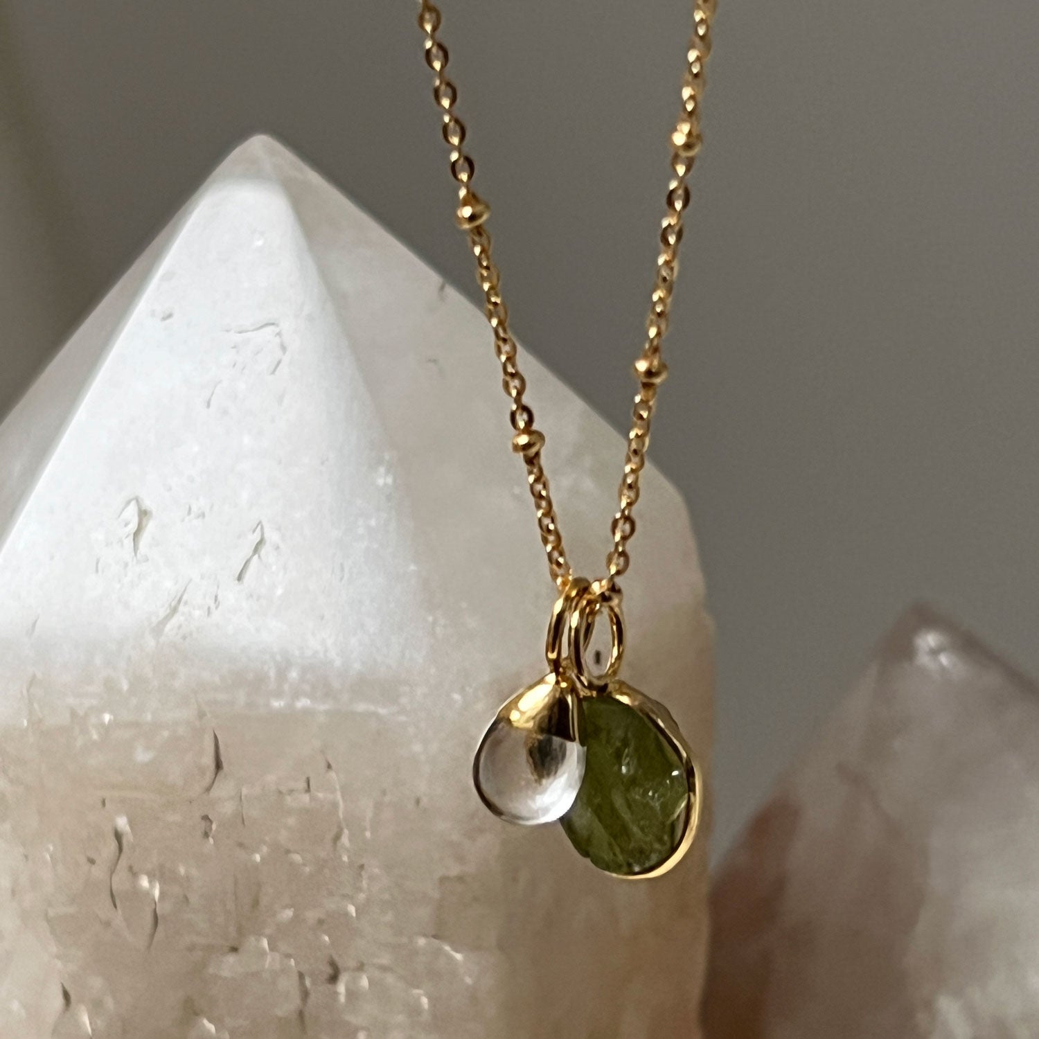 Freeform Raw Peridot slice with Smooth Rock Crystal Drop on Satellite chain